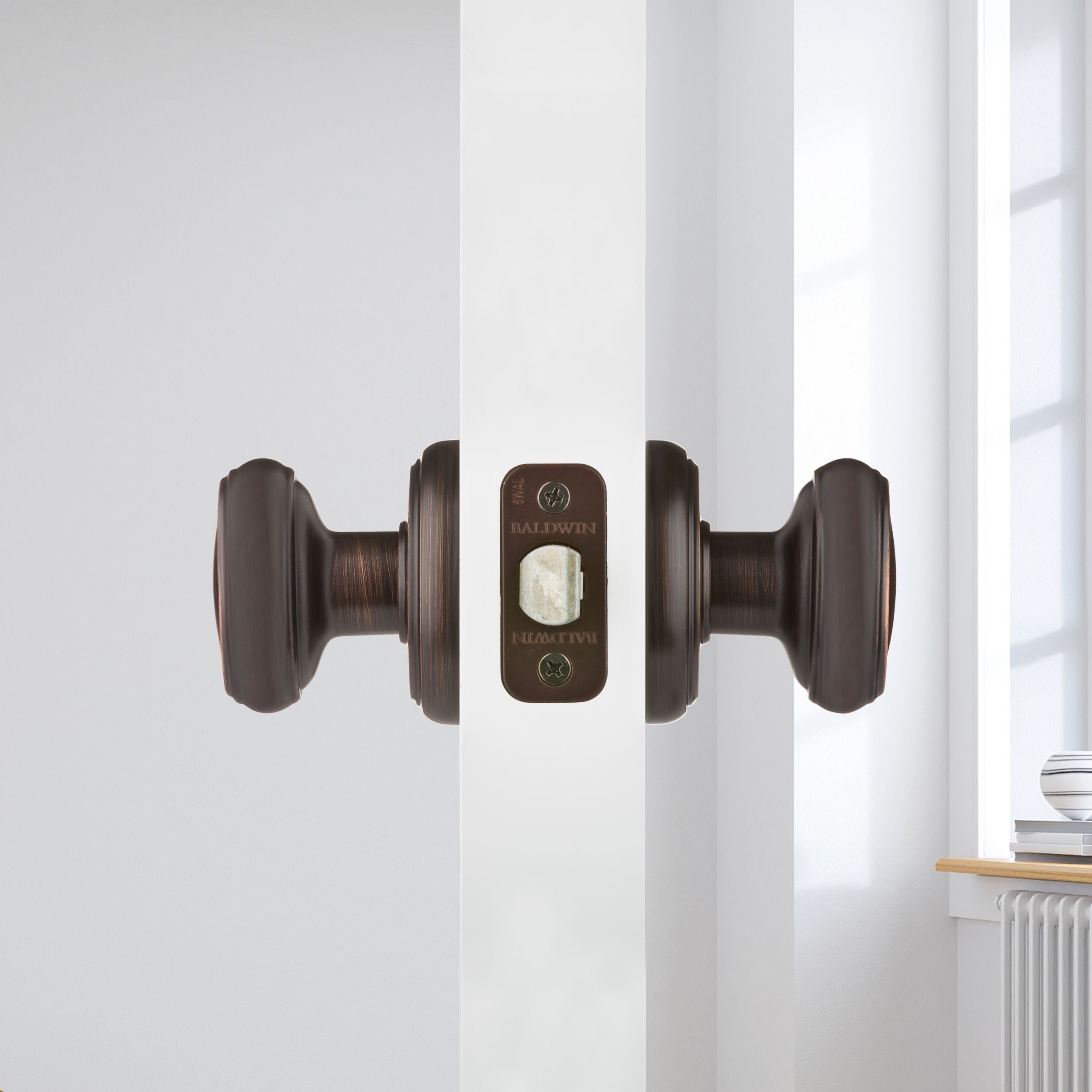 Baldwin - Prestige Collection - Knobs & Levers - Carnaby (CYK) Knob w/ Round Rose In Venetian Bronze